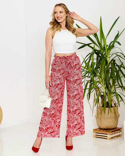 Красные женские брюки из ткани с принтом - Одежда