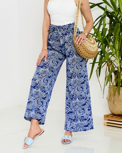 Темно-синие женские брюки из ткани с принтом - Одежда