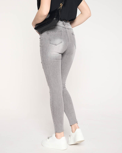 Pilki plėšyti džinsai moterims - Drabužiai