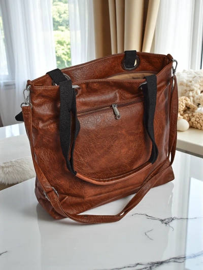 Женская сумка Calista коричневая из экокожи с заклепками 41x35 см