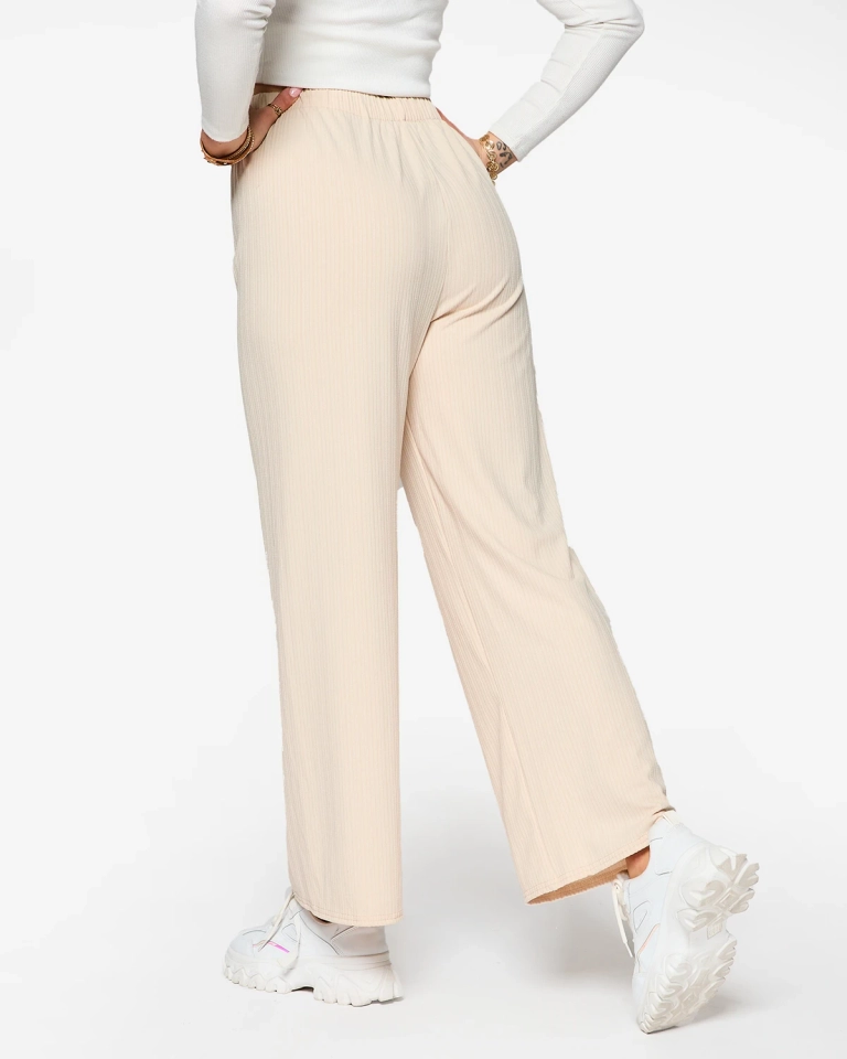 Бежевые женские широкие ребристые брюки - Одежда