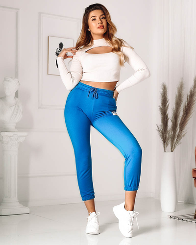 Синие женские треники с нашивками- Одежда