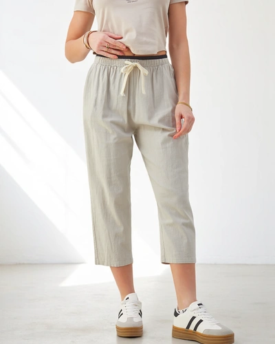 Royalfashion Medvilninės plačios moterų kelnės su raišteliu