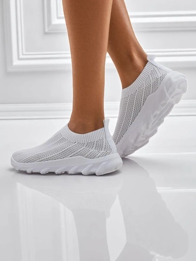 Women's white Astrea sneakers made of breathable fabric on a flat sole