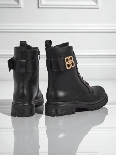 Artemisia Nero leather ankle boots with a round toe, zipper and gold buckle