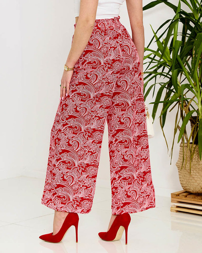 Красные женские брюки из ткани с принтом - Одежда