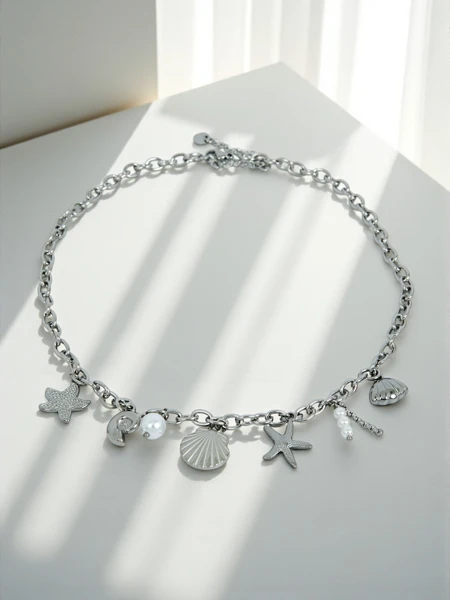 Vėrinys „Atena Charm Sea“ – auksiniai amuletai su jūros motyvais