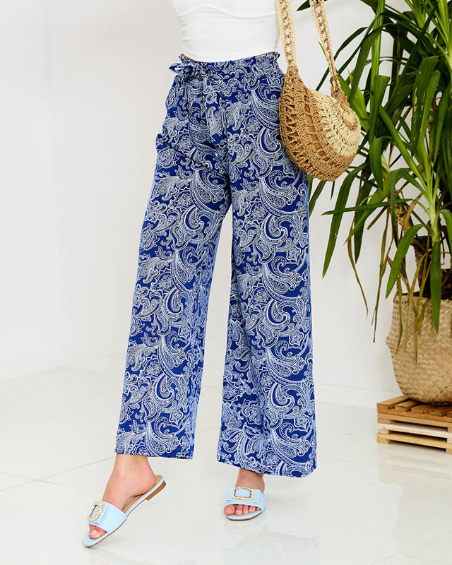 Темно-синие женские брюки из ткани с принтом - Одежда