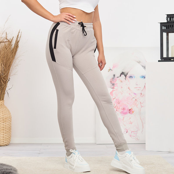 Moteriškos šviesiai pilkos sportinės kelnės su įdėklais- Drabužiai