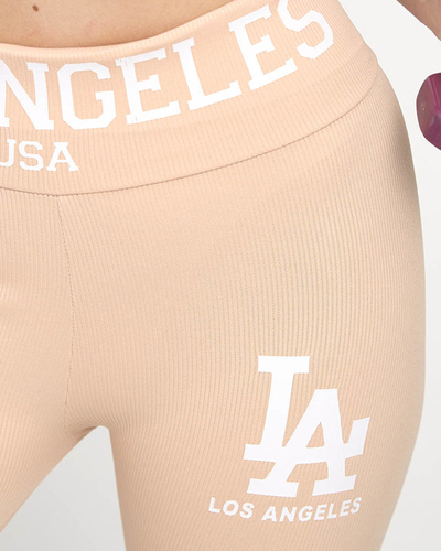 Пудрово-розовые леггинсы в рубчик с белой надписью