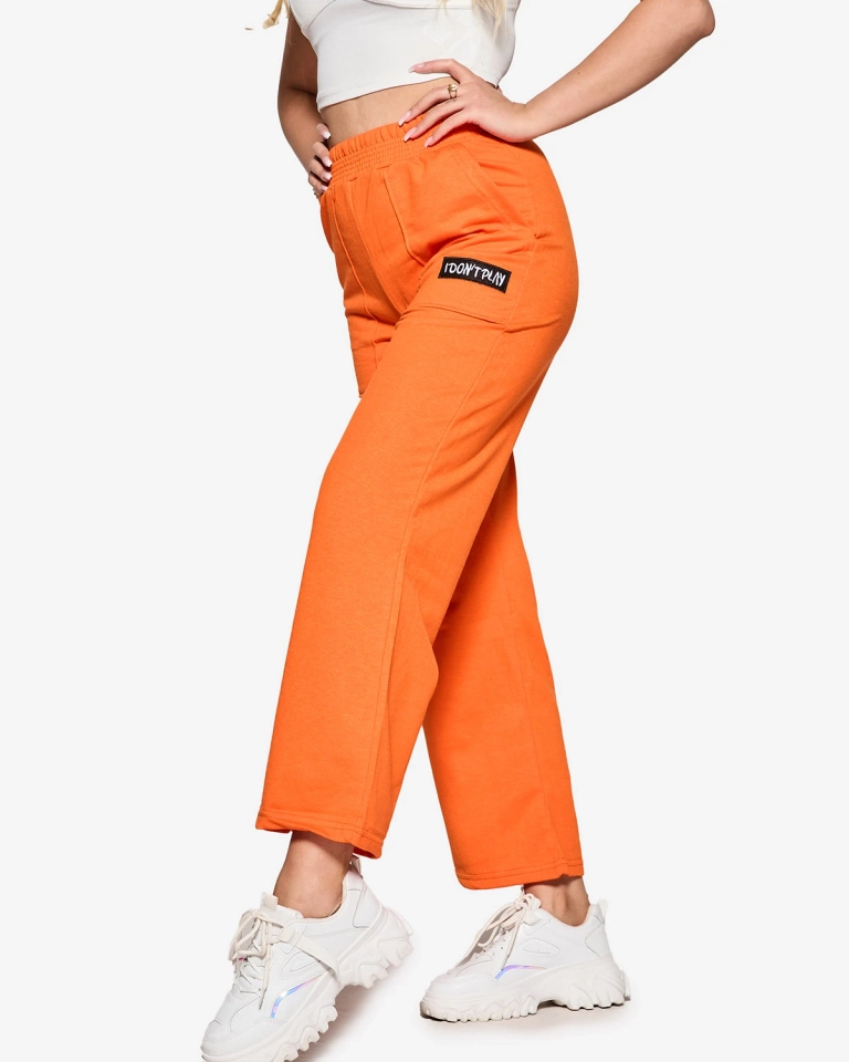 Moteriškos oranžinės plačios sportinės kelnės - Apranga