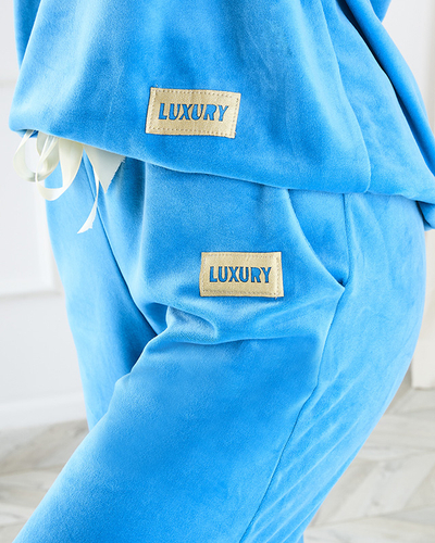 Женский синий спортивный костюм с золотыми нашивками - Одежда