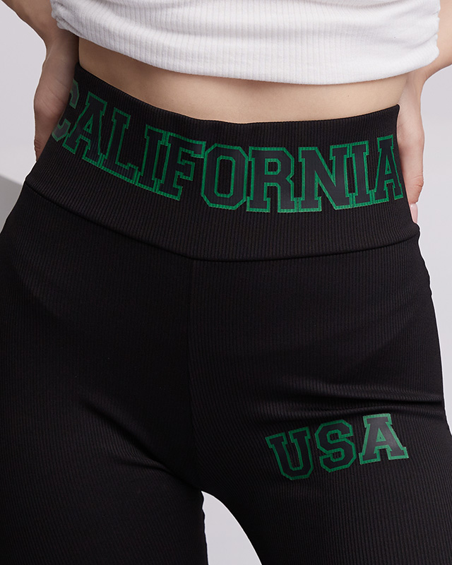 Черные женские леггинсы в рубчик с зелеными надписями