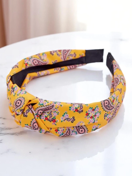 Royalfashion Molly Twist raštuotas pintas lankelis plaukams