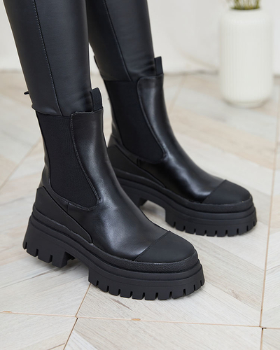Royalfashion Женские сапоги на плоском каблуке черного цвета Neyda