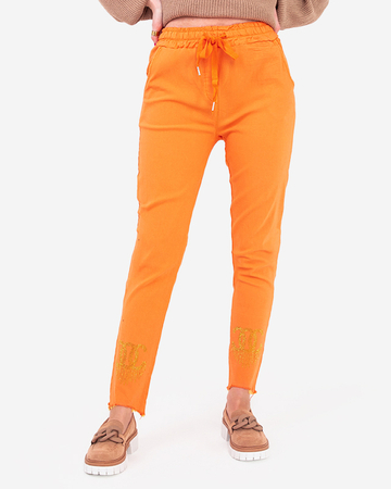 Oranžinio audinio moteriškos kelnės su kubiniais cirkoniais - Drabužiai