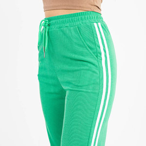 Žalios moteriškos sportinės kelnės su baltomis juostelėmis - Drabužiai
