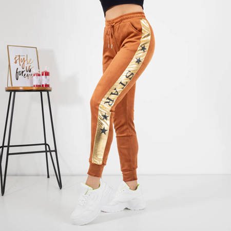 Женские коричневые спортивные штаны с золотыми лампасами - Одежда