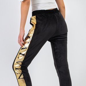 Женские черные утепленные спортивные брюки с золотыми полосками - Odież